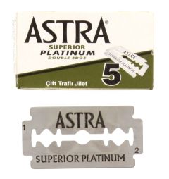 A box of Astra Superior Platinum Double Edge Razor Blades with one open blade underneath 